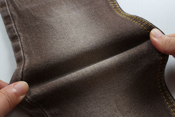 ভালো দাম সুপার ব্রাউন স্ট্রেচ ডেনিম ফ্যাব্রিক ফর উইমেন ম্যান জিন্স লো স্ট্রেচ প্রতিযোগিতামূলক দাম চীন ফোশান সিটি থেকে অনলাইন